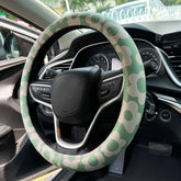Naxizo front view of sage green floral steering wheel cover showing pattern and fit