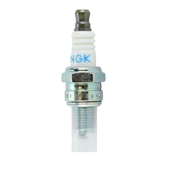 NGK CMR6H insulator detail showing 5-rib ceramic design to reduce flashover and improve reliability