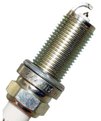 NGK spark plug side profile showing reach and ceramic insulator for correct fit