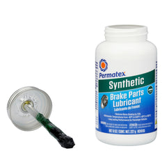Permatex lubricant applied to caliper pins to prevent seizing and ensure smooth movement
