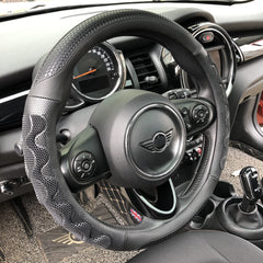 PINCTROT front view of all-black steering wheel cover showing grip benefits