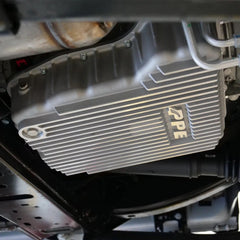 Pacific Performance Engineering neodymium drain plug closeup capturing ferrous debris benefit