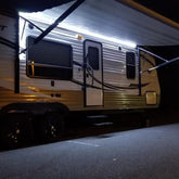 QVEVDACAR full-length awning LED strip showing even illumination for evenings