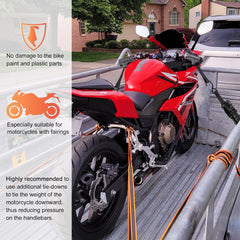 Racrank straps securing a scooter on a trailer for safer transport
