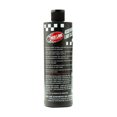 Red Line bottle open pouring liquid lube for easy, mess-free application