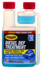 Pouring Rislone DEF Treatment into a vehicle DEF tank to prevent deposits