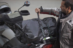 ROK Straps securing motorcycle luggage on rear rack, keeps cargo stable