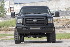 Rough Country installed on Super Duty front profile showing leveled stance benefit