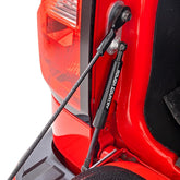 Rough Country tailgate assist front view showing compact damper and mounting points for improved ease