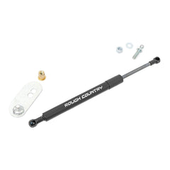 Rough Country tailgate assist next to ruler for scale illustrating compact, strong unit