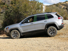Rvinyl full installed matte black pillar set on Jeep Cherokee showcasing cohesive styling