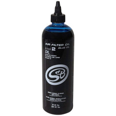 S&B blue oil applicator close-up showing precision tip and measured drops