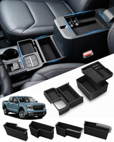 SEVEN SPARTA front center tray showing neat phone and wallet storage benefit
