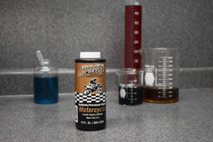 Spectro Oil close-up of golden fluid texture highlighting cleaner-burning formulation
