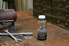 Spectro Oil being measured into fuel for a chainsaw showing correct premix use