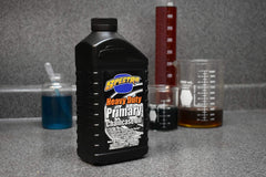 Close-up of Spectro Oil label highlighting polymer formula and SAE 85 benefits for clutch control