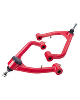 SUCOSO upper control arm front view showing red finish and mounting points for clear fitment