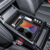 TACOBRO front view installed in Sorento console showing tidy storage benefit