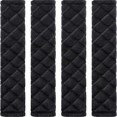 Tatuo front view of four black seat belt pads showing neat pack and style benefit
