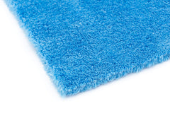 The Rag Company towel in use buffing a car for streak-free finishing