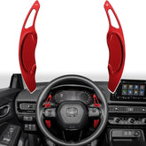 Thenice front view of red paddle shifter extensions showing sporty upgrade benefit