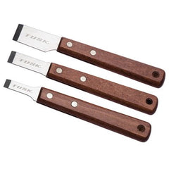 TUSK close-up of ergonomic handle and sharp blade edge ensuring precise, damage-minimizing scraping