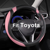 West Llama front view of black and pink steering wheel cover showing design and fit benefits