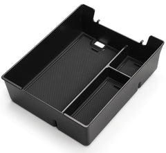 Wuchurth top-down of tray compartments displaying organized spaces for phones and coins