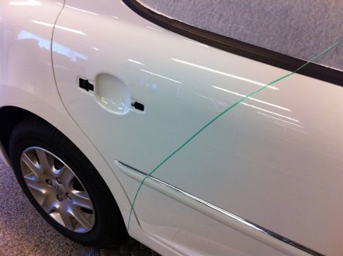 3M knifeless tape removed cleanly to show no-residue removal benefit