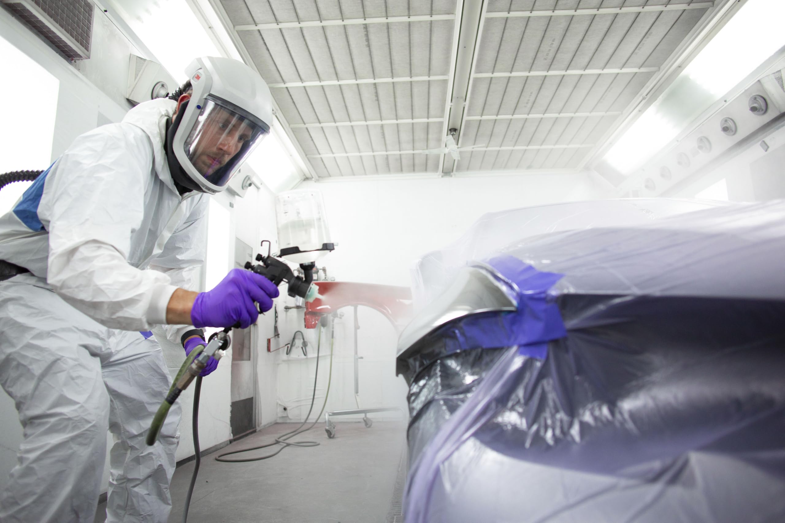 3M spray gun connected to pressure hose for continuous bulk spraying efficiency