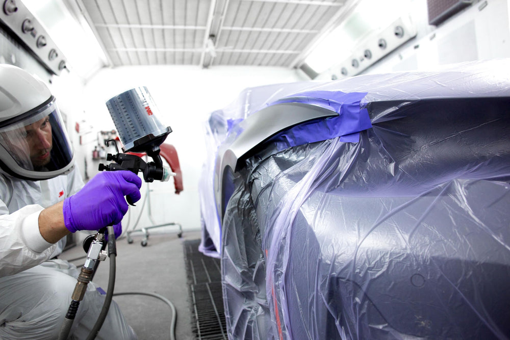 3M spray gun with PPS cup installed demonstrating low-waste spot repair use