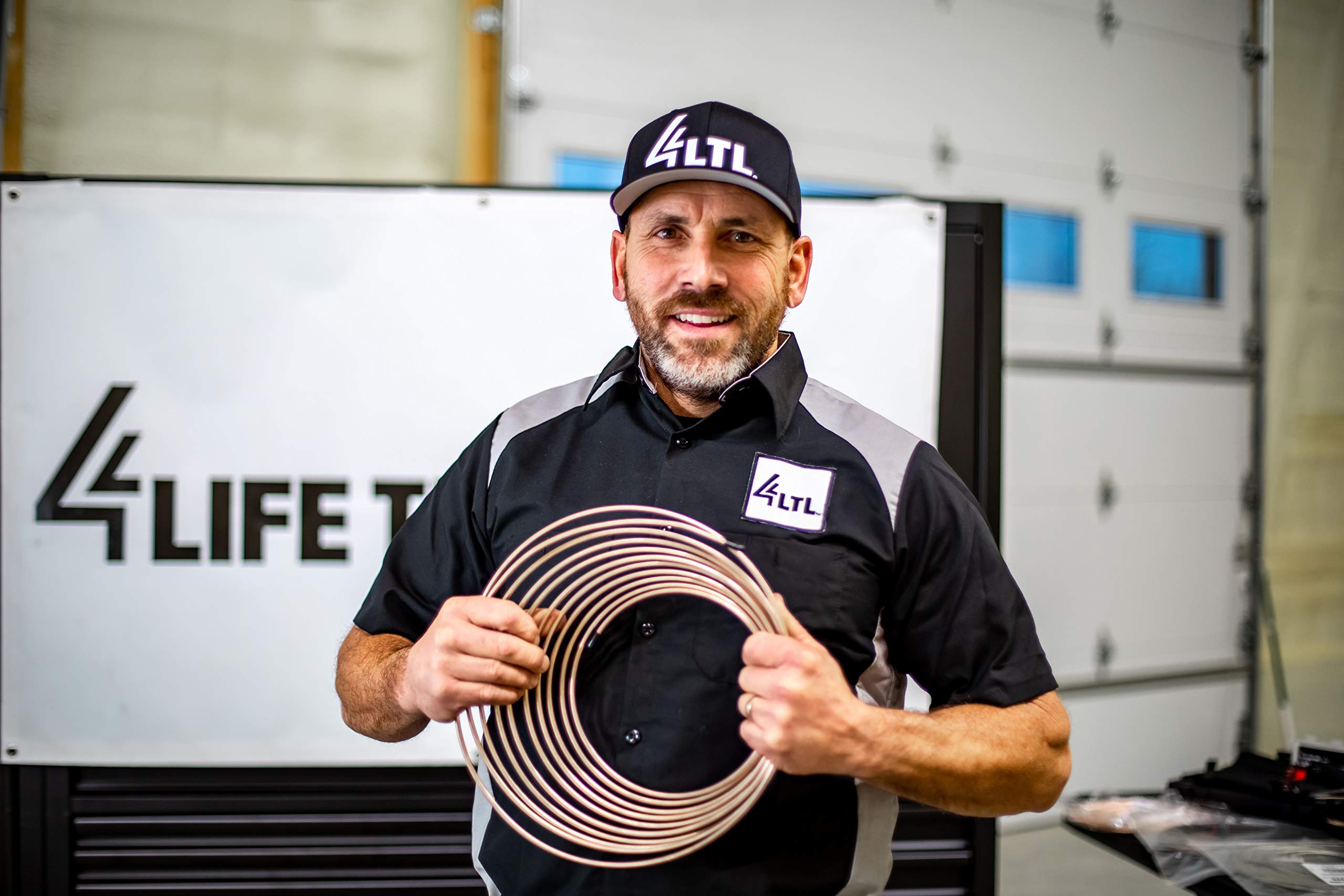 4LIFETIMELINES coil beside measuring tape showing 25-foot length and coverage advantage