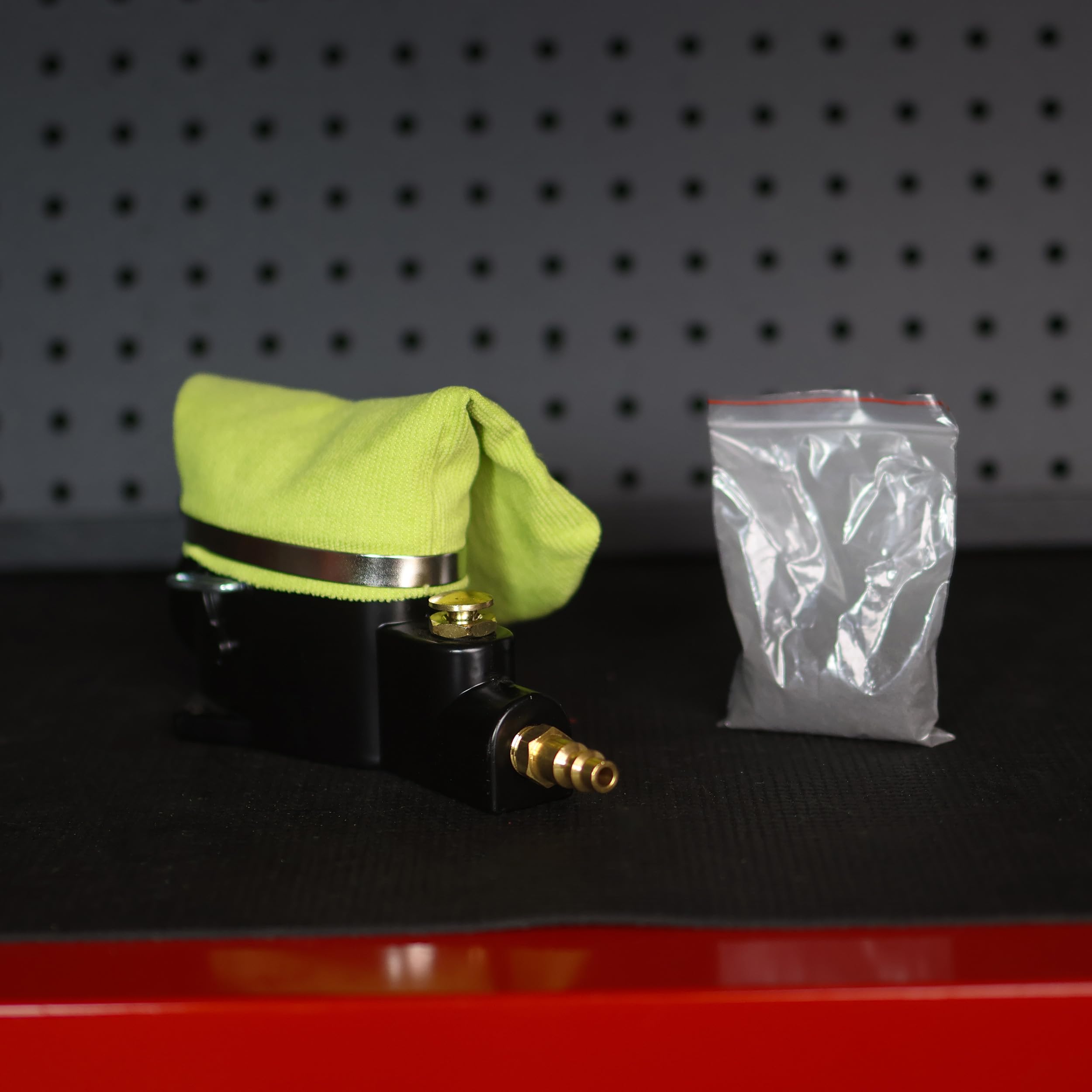 ABN clamp and brass fitting detail demonstrating durable, leak-resistant connection