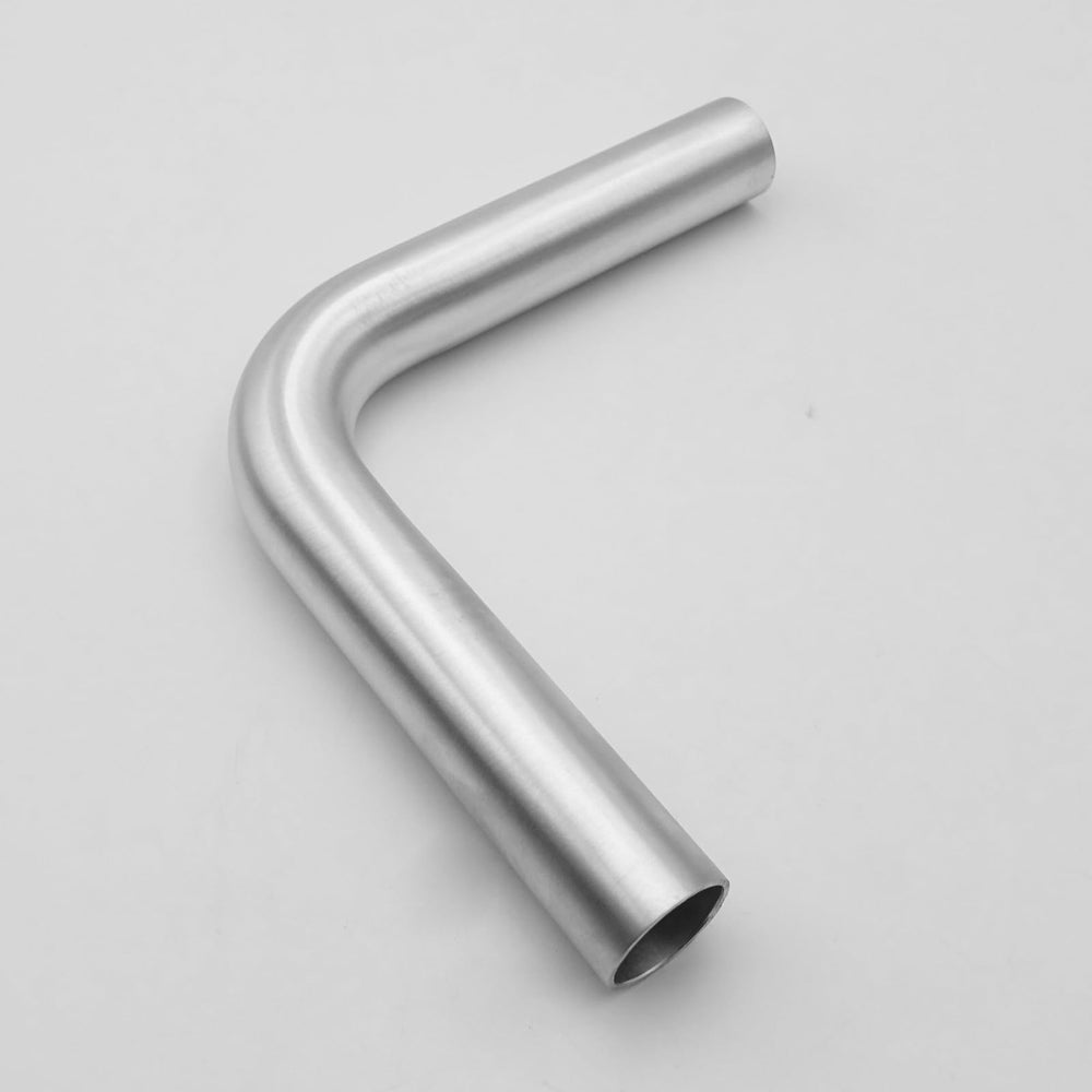 AC PERFORMANCE elbow installed in engine bay demonstrating compact routing benefit