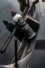 Adam's Polishes used on exterior door trim demonstrating restored dark finish benefit