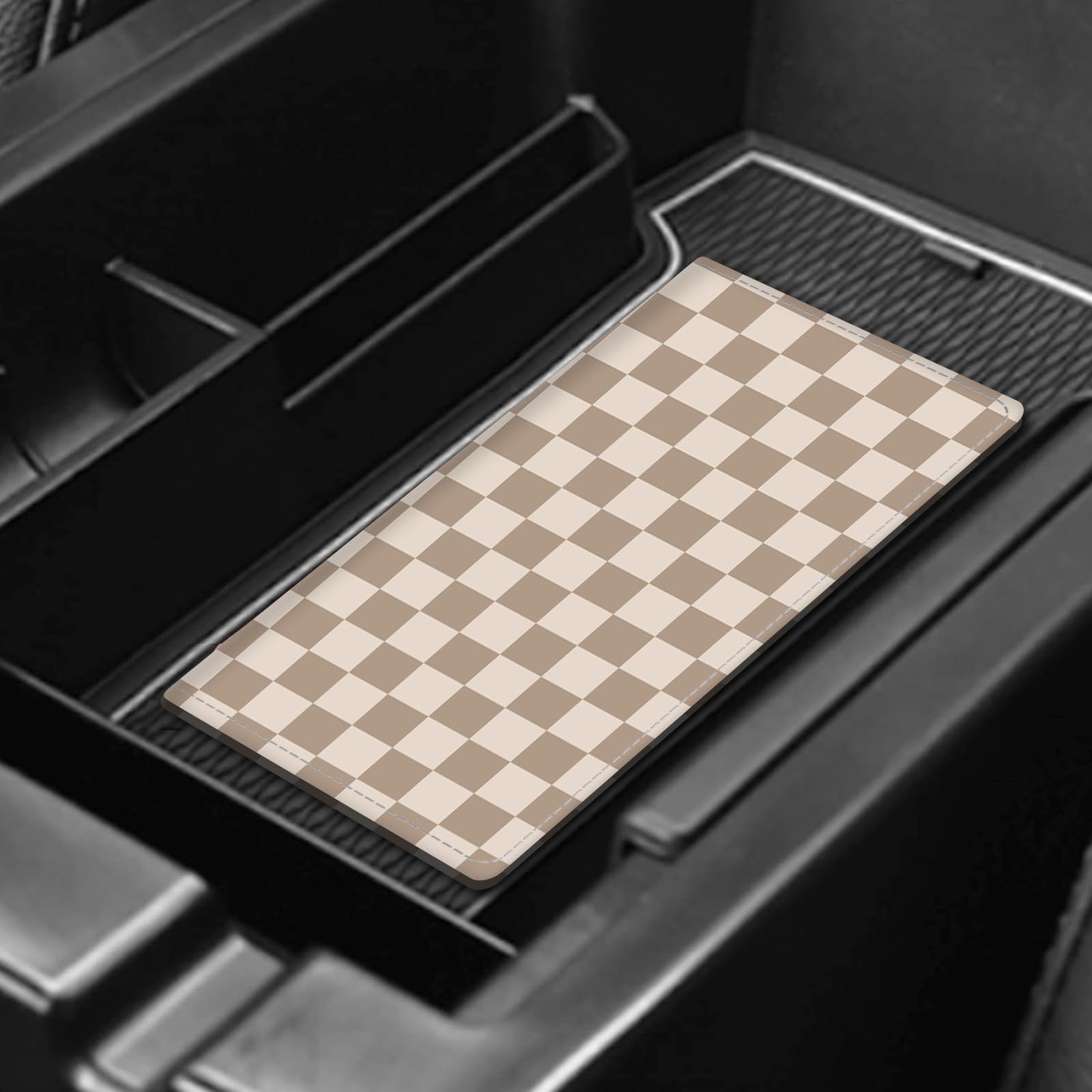 ADUQLZUX held in a glovebox showing compact fit and convenient reach