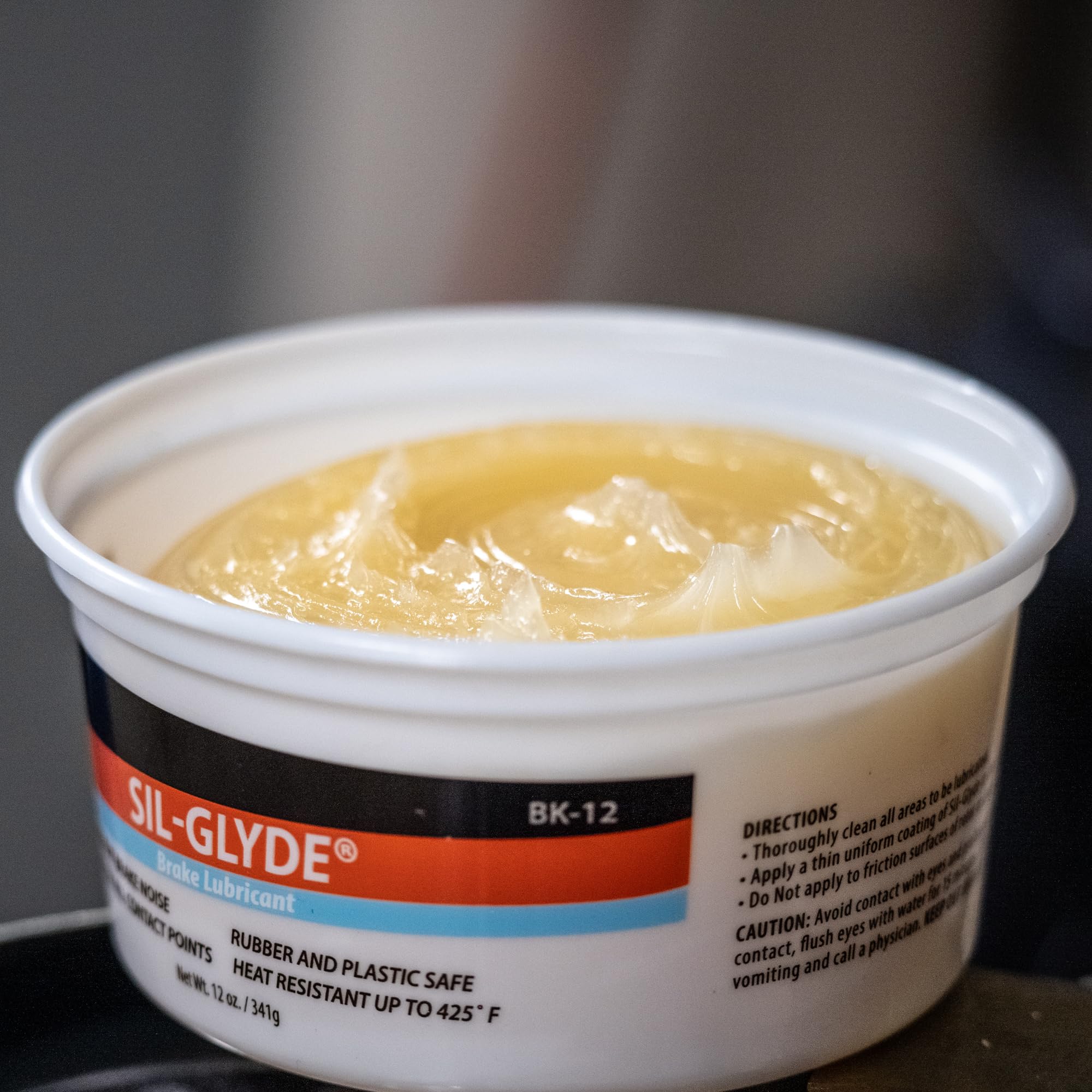 AGS SIL-Glyde silicone paste close-up texture showing smooth, durable consistency