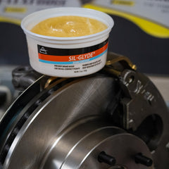 AGS SIL-Glyde tub open with visible paste demonstrating easy access and application