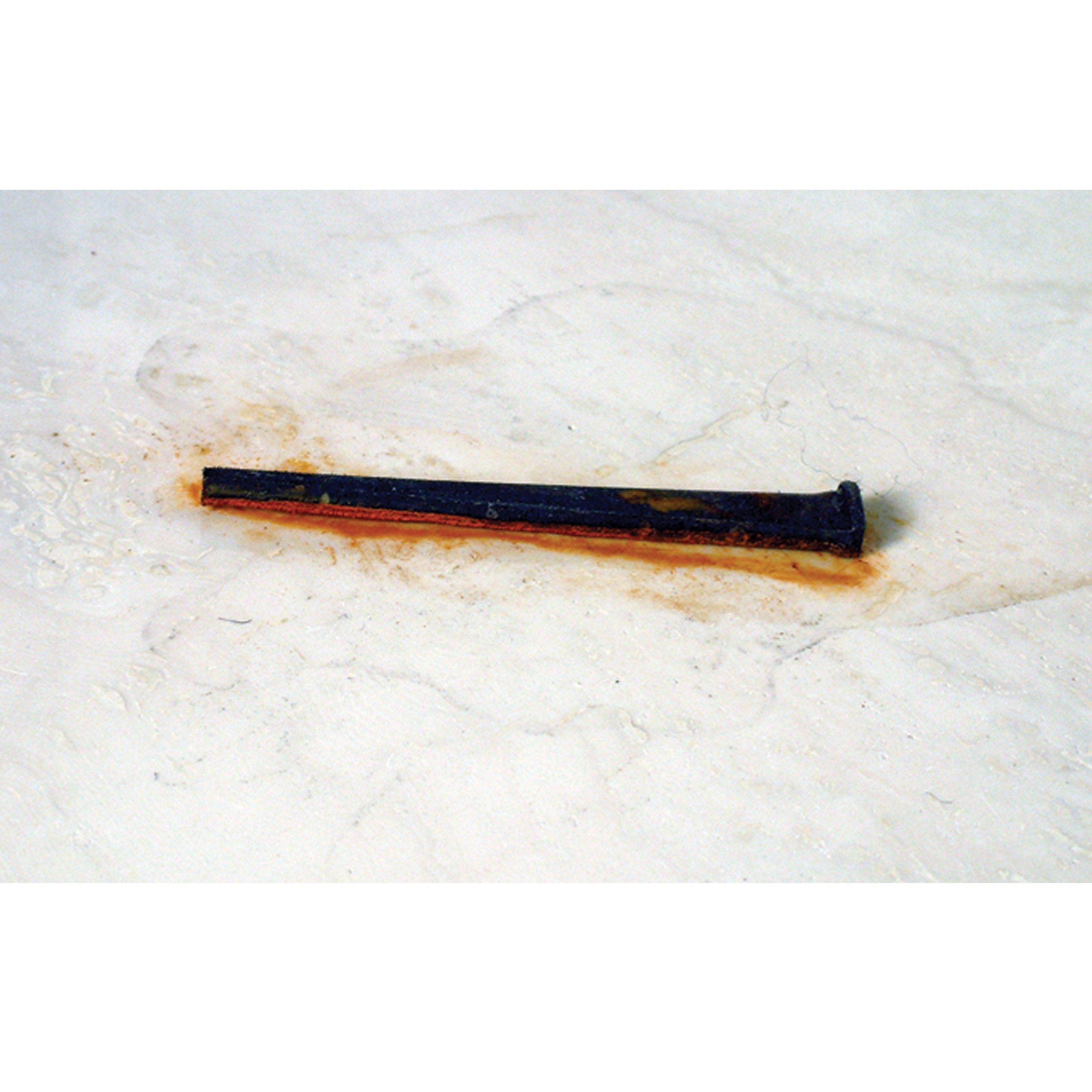 Alpha Professional Tools gel applied to rust-stained brick, demonstrating effective clinging and lifting
