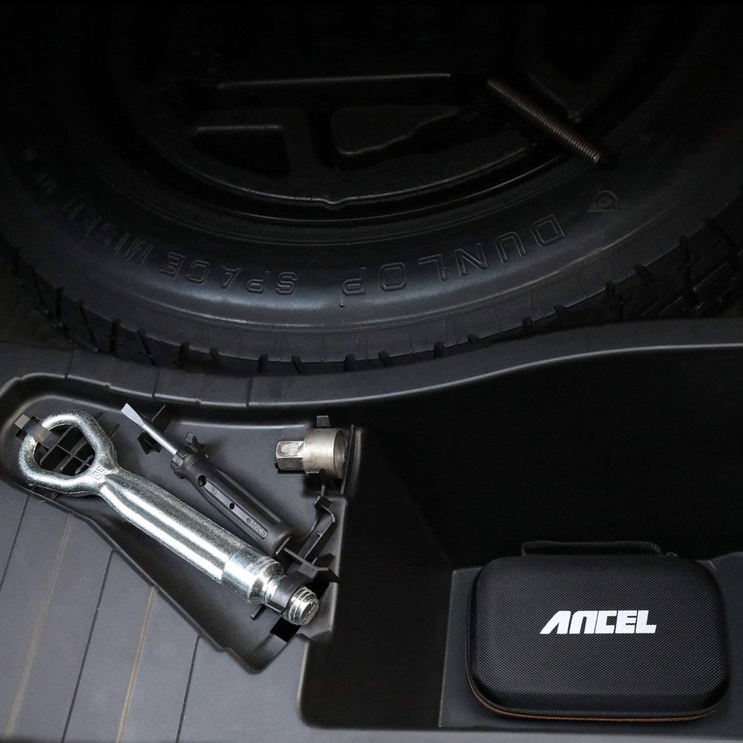 ANCEL case stowed under a car seat demonstrating compact travel-friendly size