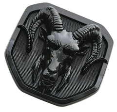 Anyfew emblem installed on truck tailgate showing cohesive blacked-out benefit