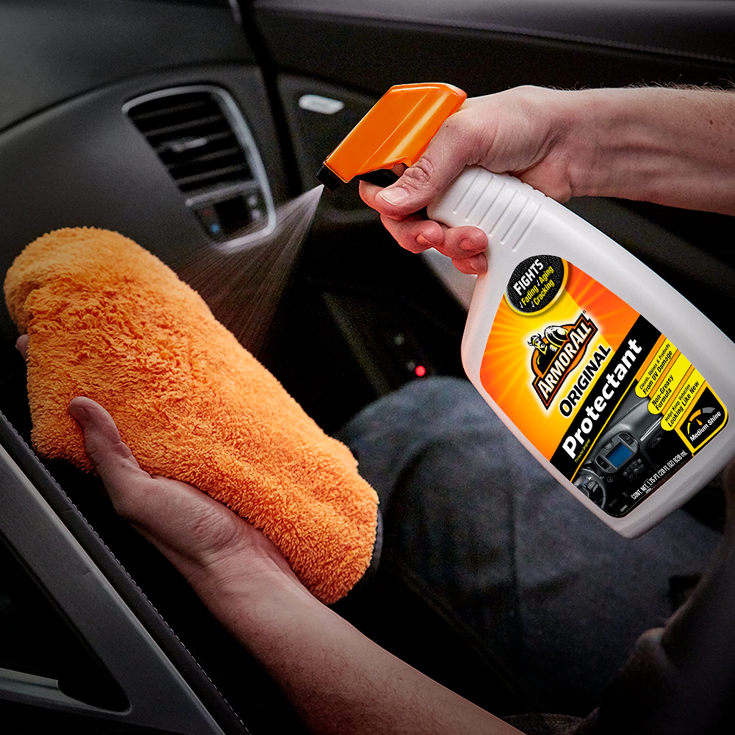 Armor All being applied to a dashboard showing cleaning action and immediate refresh benefit