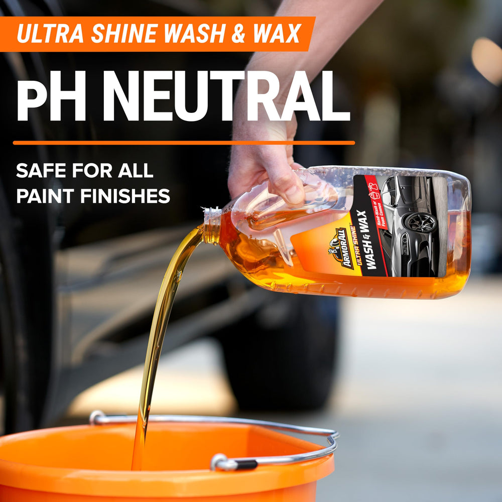 Armor All mitt in hand washing car door, improving safe paint cleaning