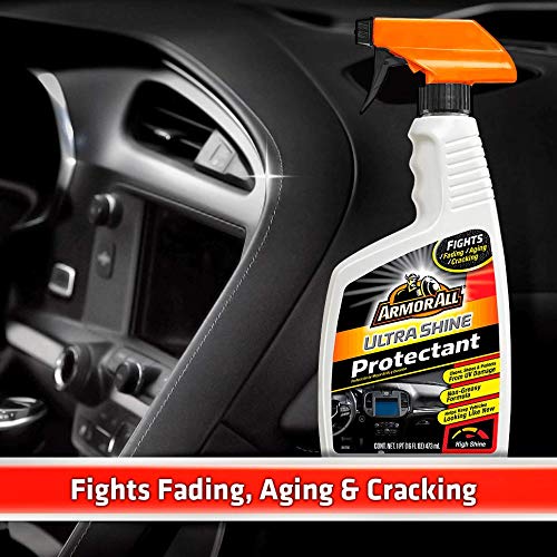 Armor All being sprayed on a dashboard demonstrating quick cleaning and shine