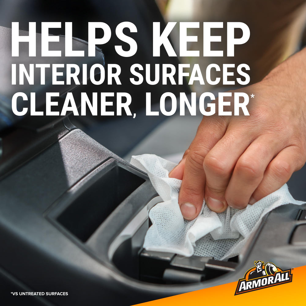Applying Armor All wipe to rubber floormat to repel stains and simplify cleanup