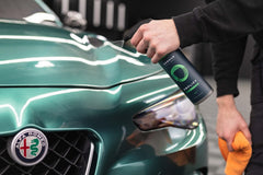 Armour Detail Supply spraying Amplify on red sedan for quick shine
