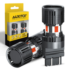 AUXITO red 3157 front view showing plug-and-play fit and clear lens for visibility