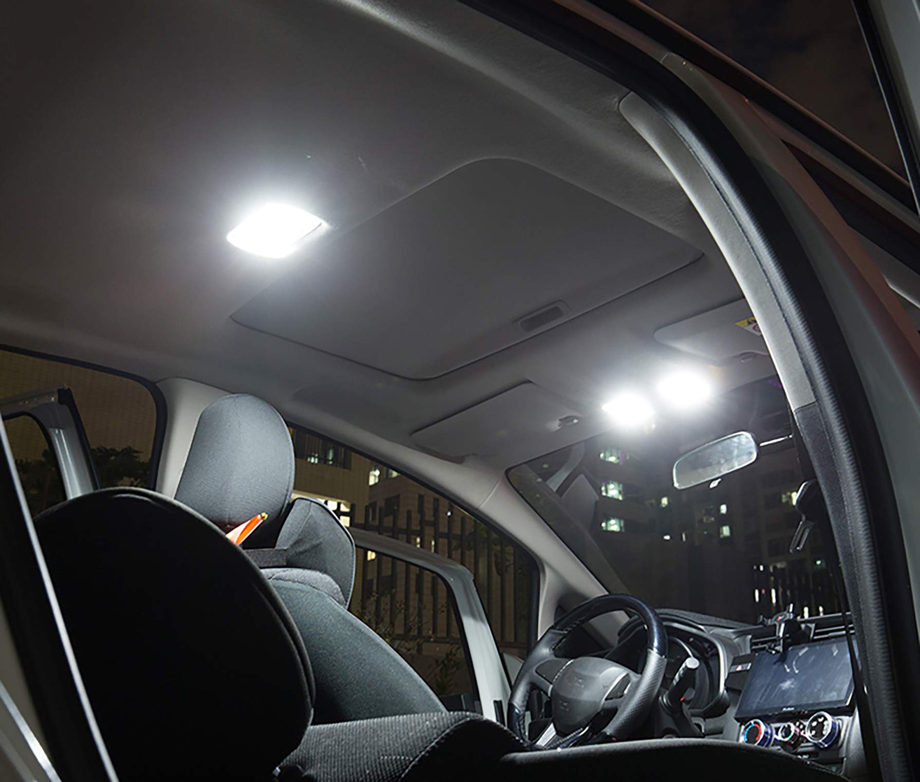AWALITED dome light comparison in truck ceiling showing brighter white versus stock yellow