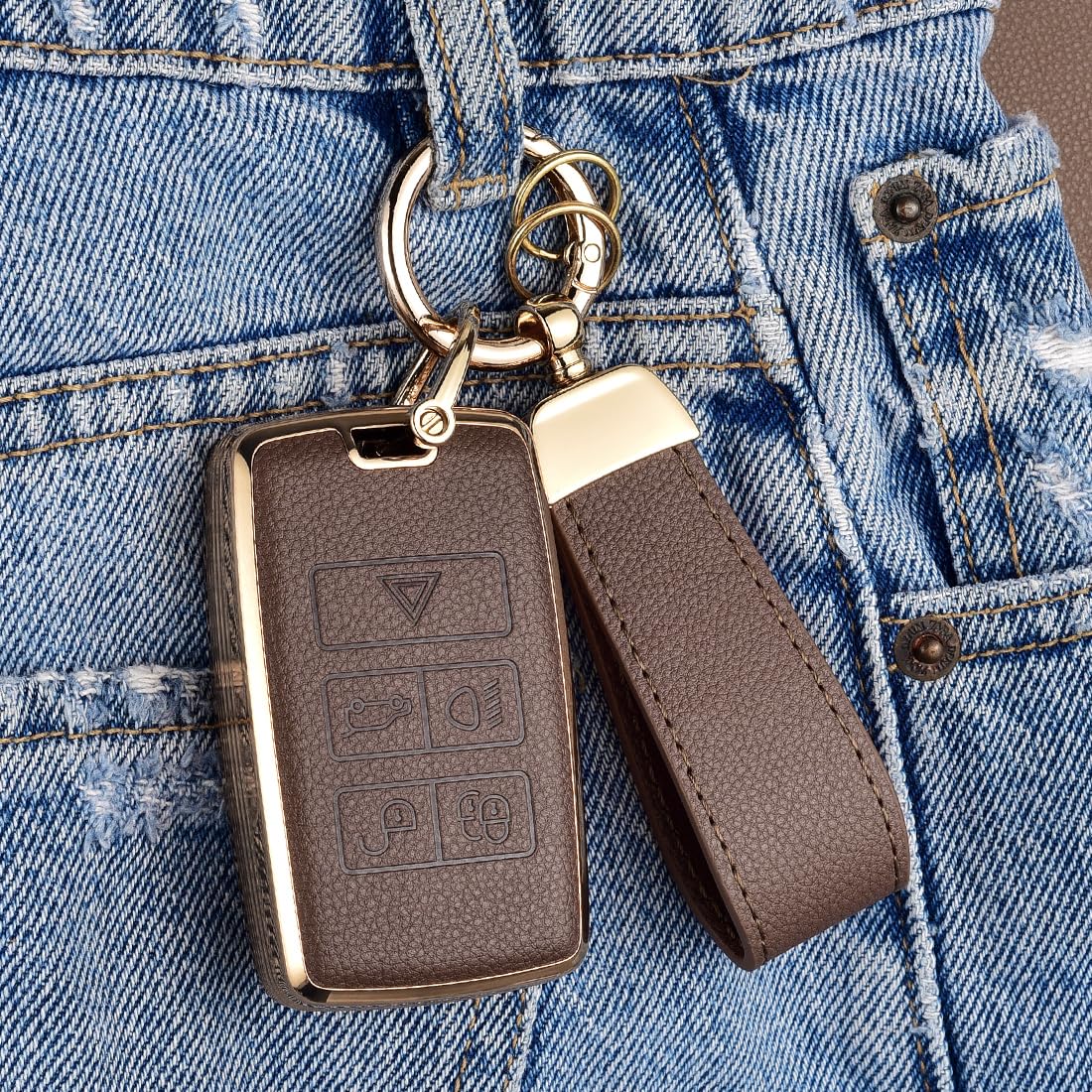 Axtrulix key fob in hand demonstrating compact scale and ergonomic grip