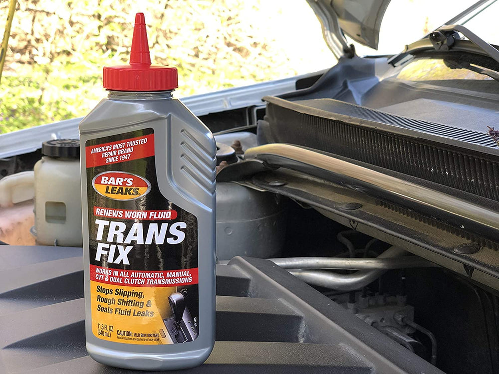 Bar's Leaks bottle placed in car engine bay demonstrating how and where to add treatment safely